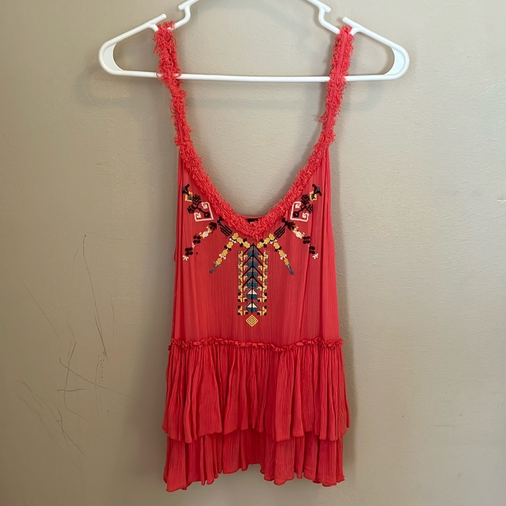 Free people tank, small hole in picture